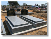 Matching high Harcourt Grey Monuments with Black OG Headstones