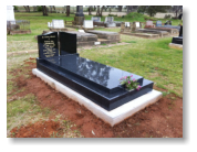 Black Monument with 2 black wing headstones