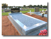 Harcourt Grey Granite Pebble in-fill Monument with Black Apex Headstone
