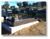 High Tan Brown Monument with Large Black OG Headstone and Vases